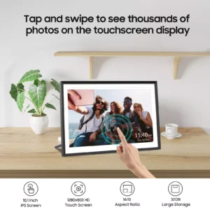 Wooden desk with a framed touchscreen photo frame showing a group selfie; a hand taps the screen.